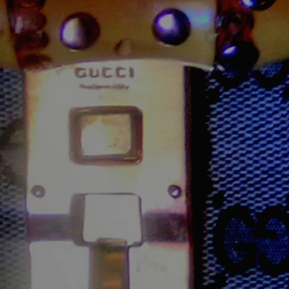 GUCCI'S BLACK CROCODILE PURSE